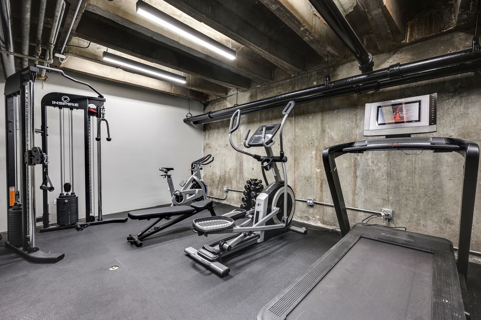 227 East Walton Place, Unit 3W Chicago, IL 60611 - Photo 13 of 15 a view of a room with gym equipment