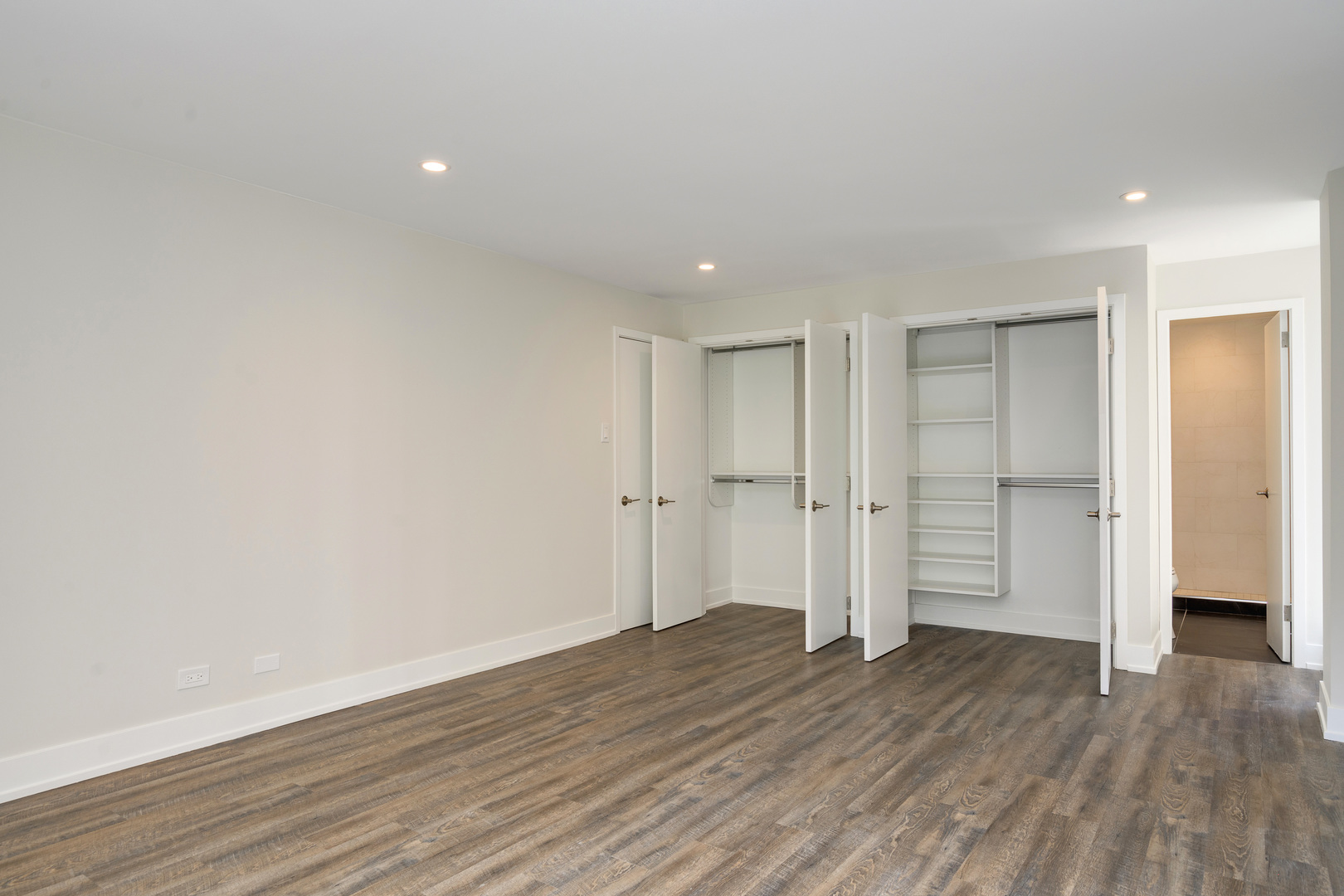 227 East Walton Place, Unit 3W Chicago, IL 60611 - Photo 9 of 15 a view of empty room with wooden floor