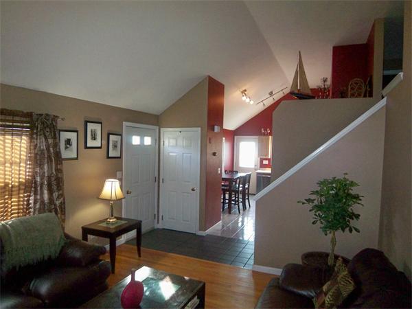 144 Morrison Road Taunton, MA 02718 - Photo 10 of 30 a living room with furniture and a potted plant