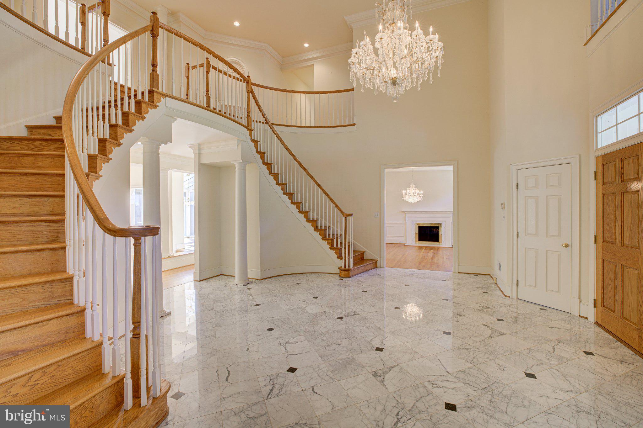 731 Utterback Store Road Great Falls, VA 22066 - Photo 2 of 19 Elegant foyer with grand staircase.