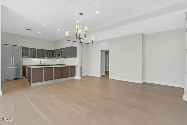 a kitchen with stainless steel appliances granite countertop a sink and a cabinets