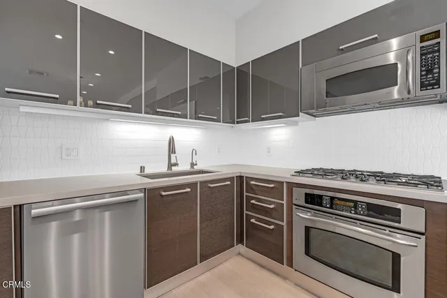 a kitchen with a sink and cabinets