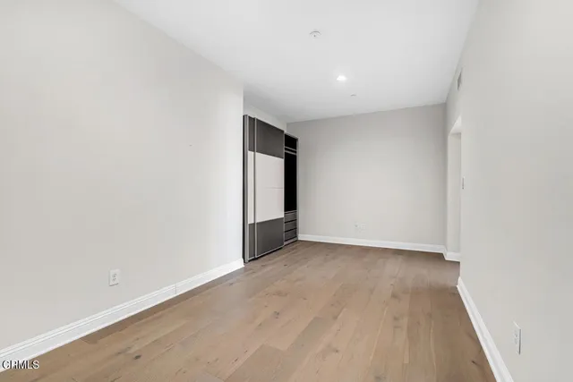 a bathroom with a sink shower and a mirror