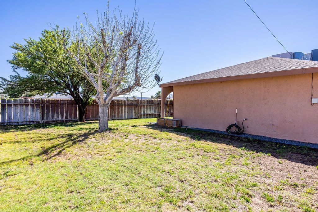 1144 West Benson Avenue Ridgecrest, CA 93555 - Photo 30 of 32 a backyard of a house