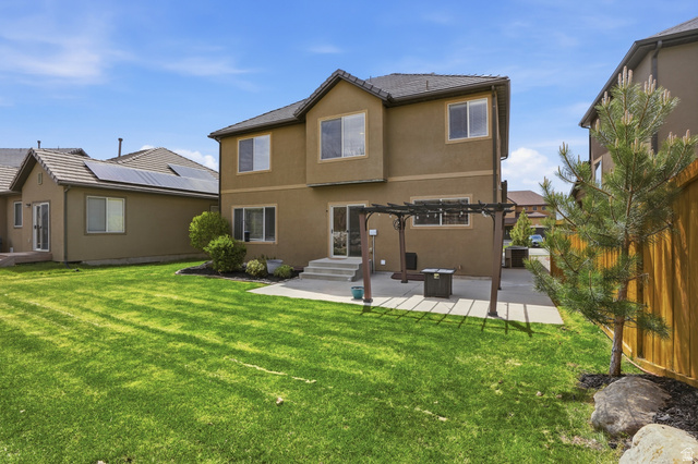 2007 Fielding Hill Lane Draper, UT 84020 - Photo 46 of 83 Expansive backyard featuring a large green lawn and a stone patio
