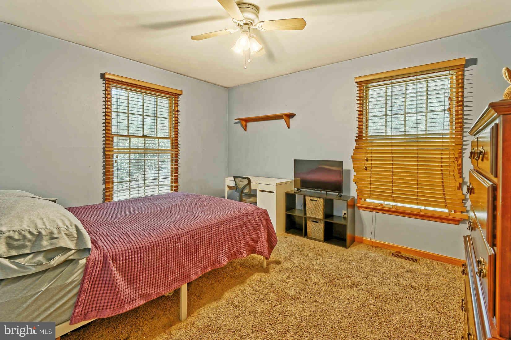 2801 Leaming Mill Road Millville, NJ 08332 - Photo 16 of 34 a bedroom with a bed and a window