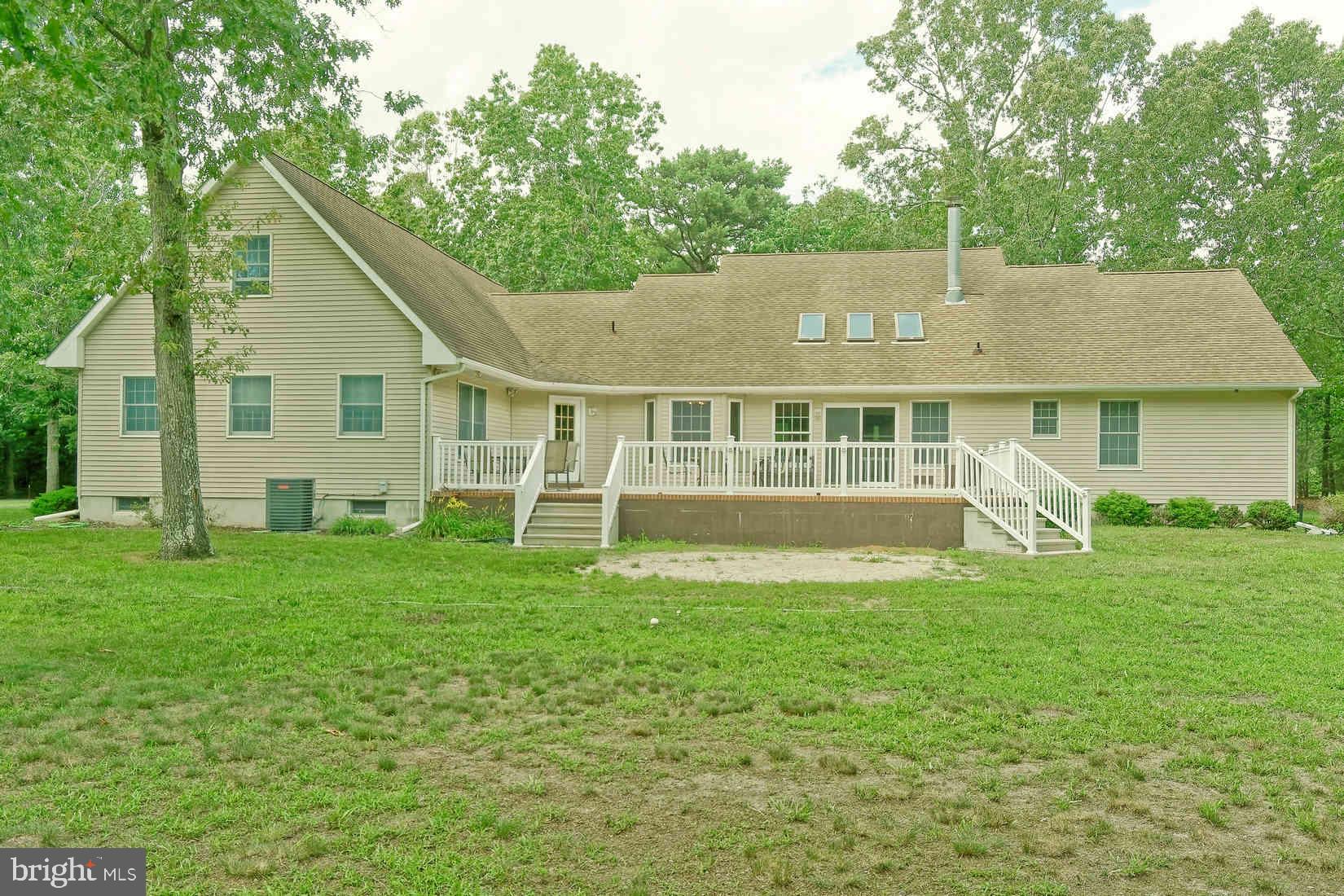 2801 Leaming Mill Road Millville, NJ 08332 - Photo 18 of 34 a view of a house with a yard deck and a patio