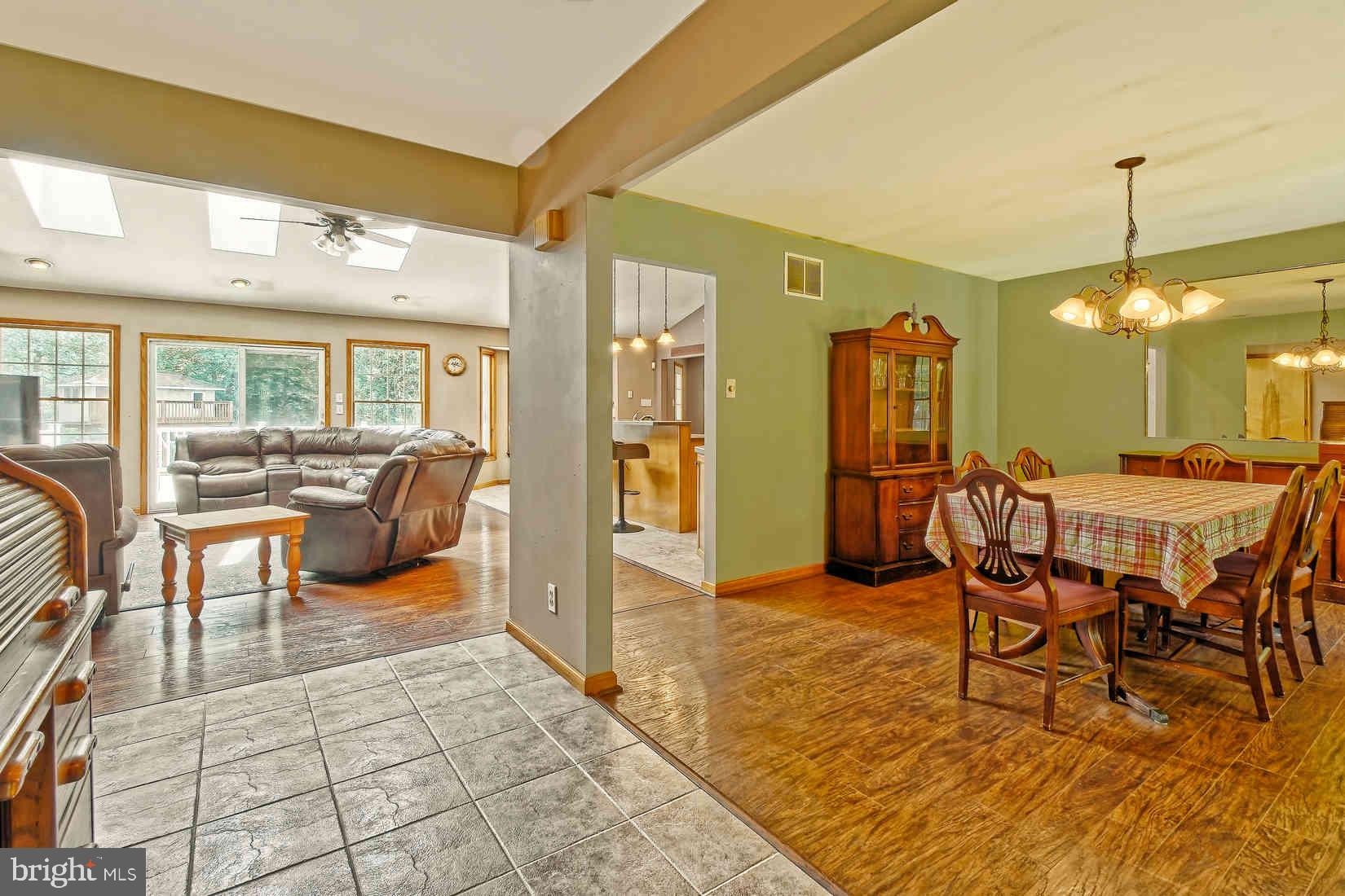 2801 Leaming Mill Road Millville, NJ 08332 - Photo 5 of 34 a dining room with furniture and a floor to ceiling window
