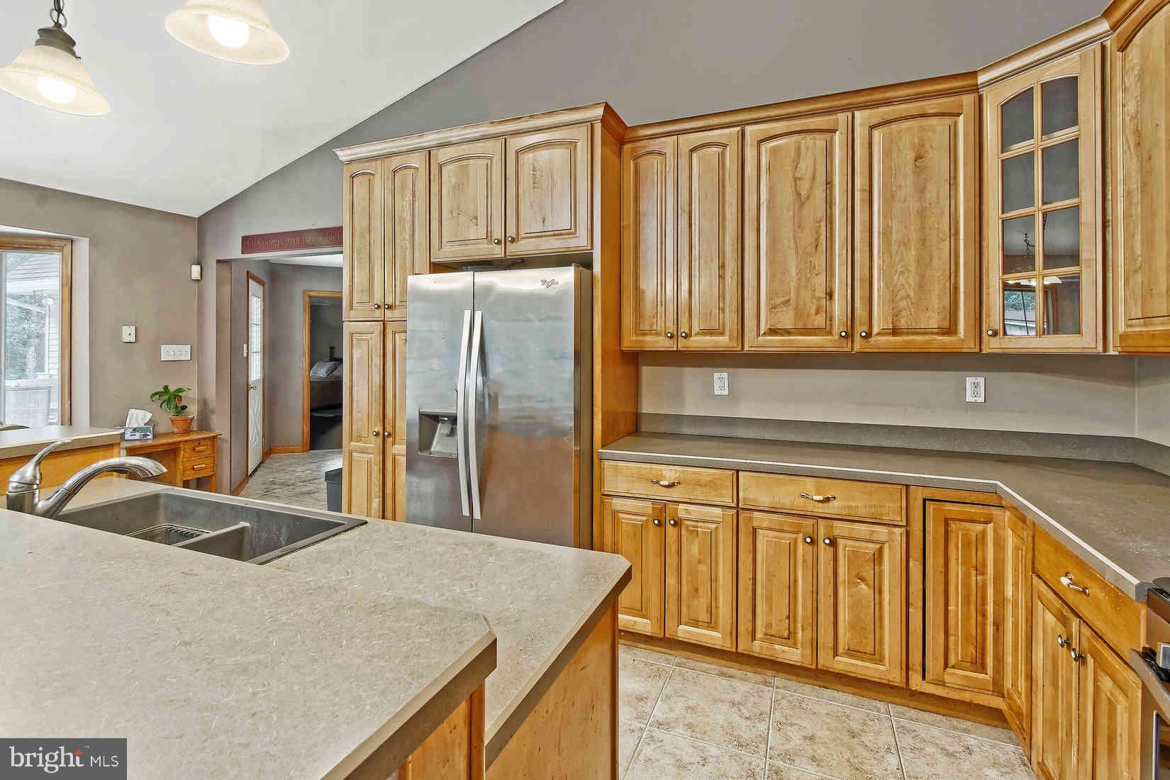 2801 Leaming Mill Road Millville, NJ 08332 - Photo 10 of 34 a kitchen with stainless steel appliances granite countertop a sink and a granite counter tops with white cabinets