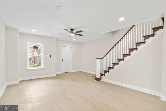 a view of an empty room with stairs