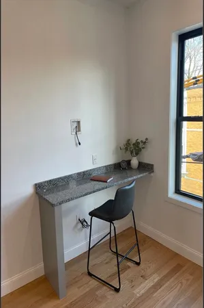 a kitchen with wooden floor and a sink