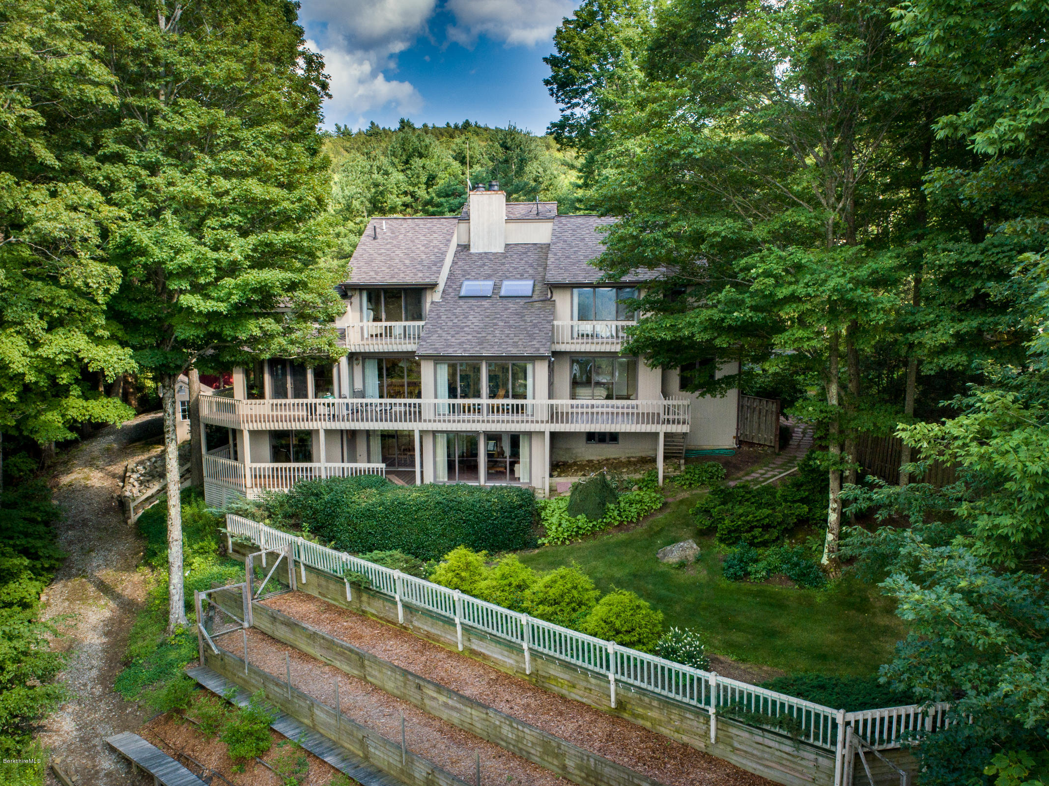 a aerial view of a house with a yard