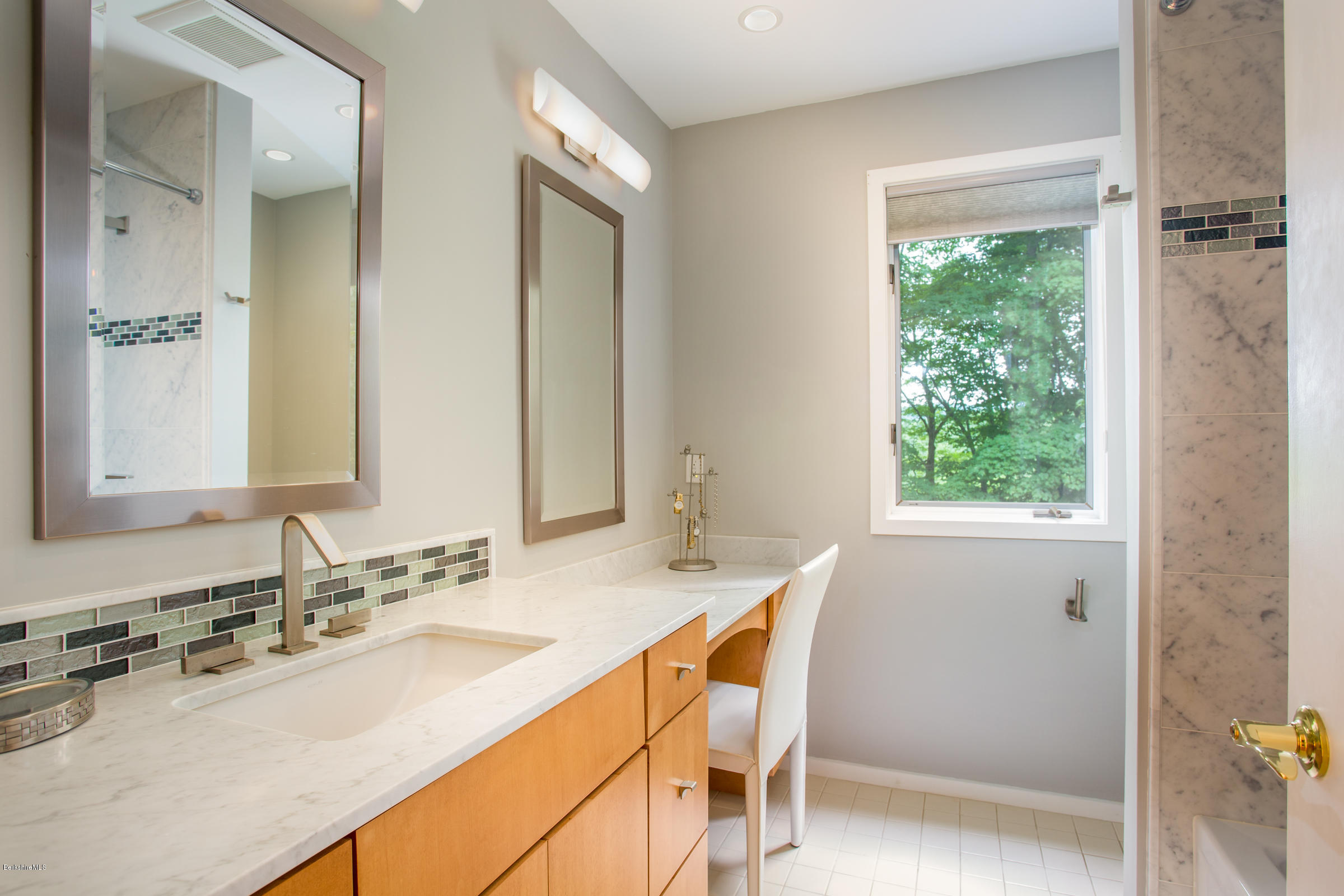 611 Main Road Monterey, MA 01245 - Photo 21 of 32 a bathroom with a granite countertop sink a mirror and a bathtub