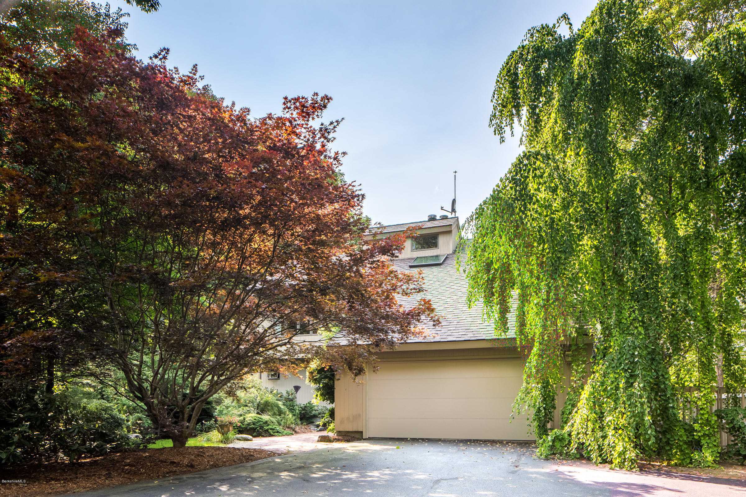 611 Main Road Monterey, MA 01245 - Photo 27 of 32 a house that has a tree in front of it