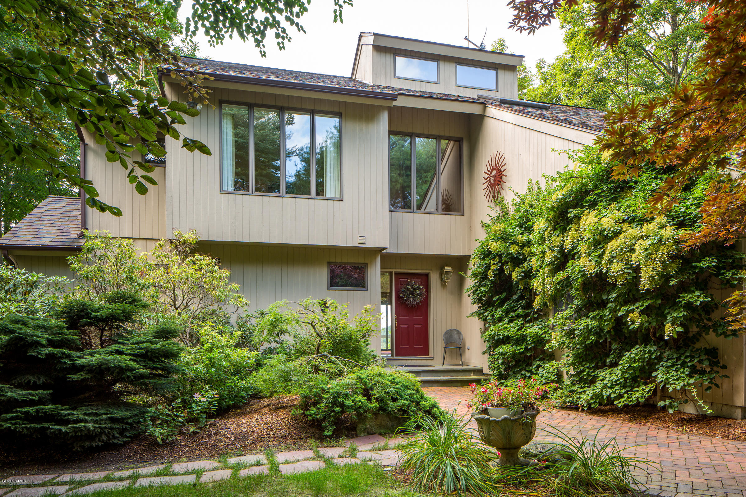 611 Main Road Monterey, MA 01245 - Photo 28 of 32 a front view of a house with garden