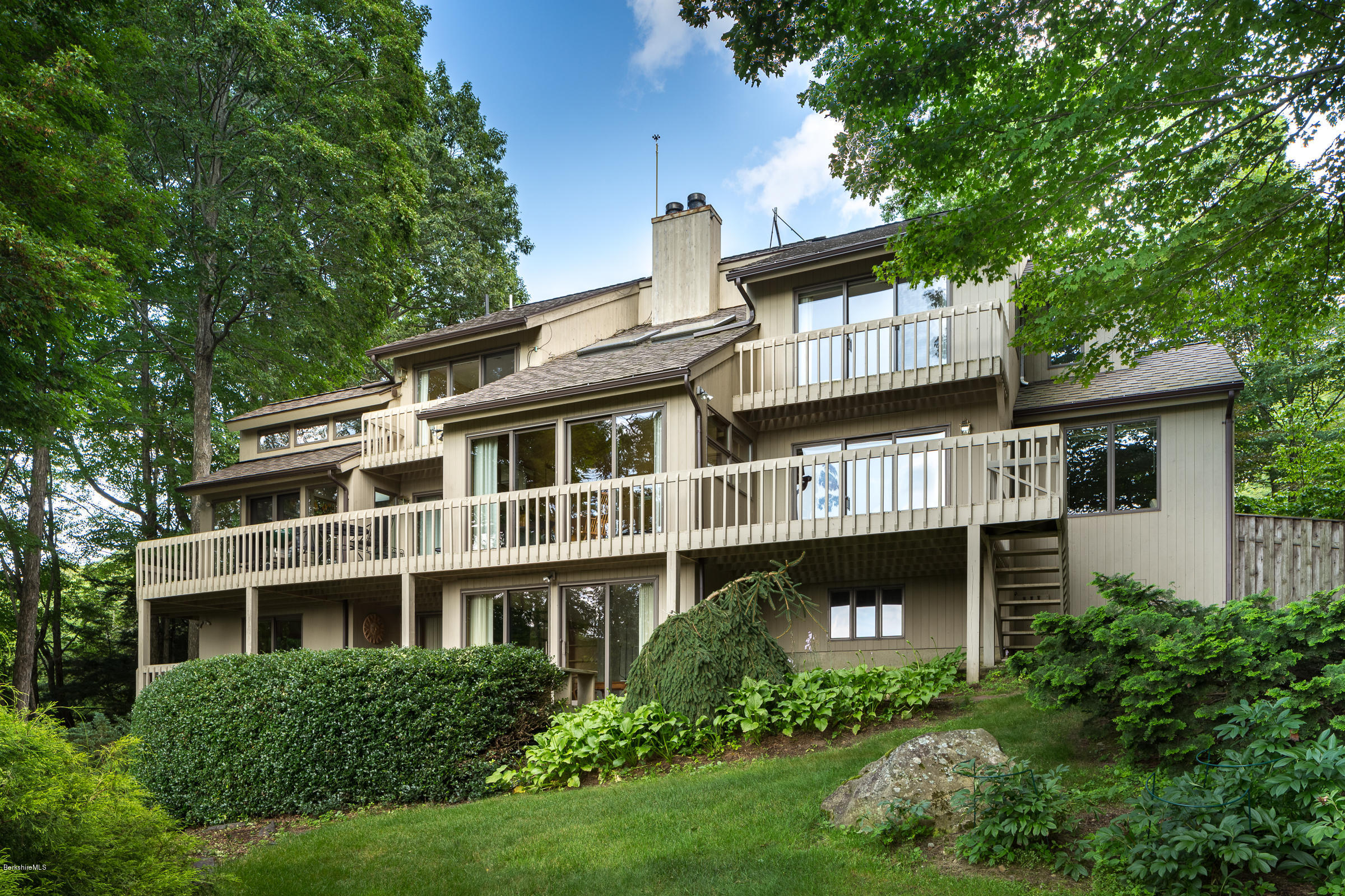 611 Main Road Monterey, MA 01245 - Photo 30 of 32 a front view of a house with a garden