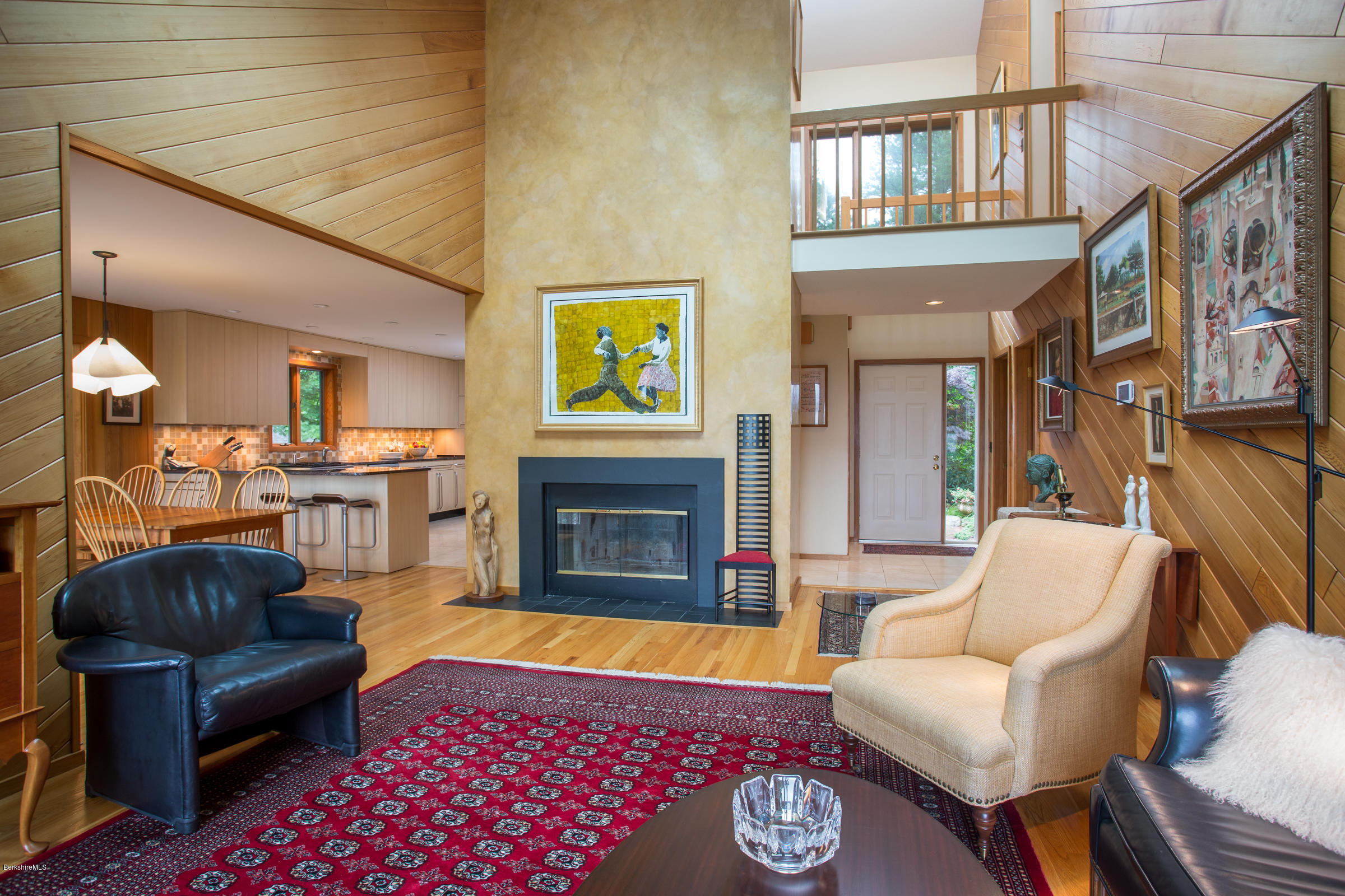611 Main Road Monterey, MA 01245 - Photo 4 of 32 a living room with furniture a rug and a fireplace