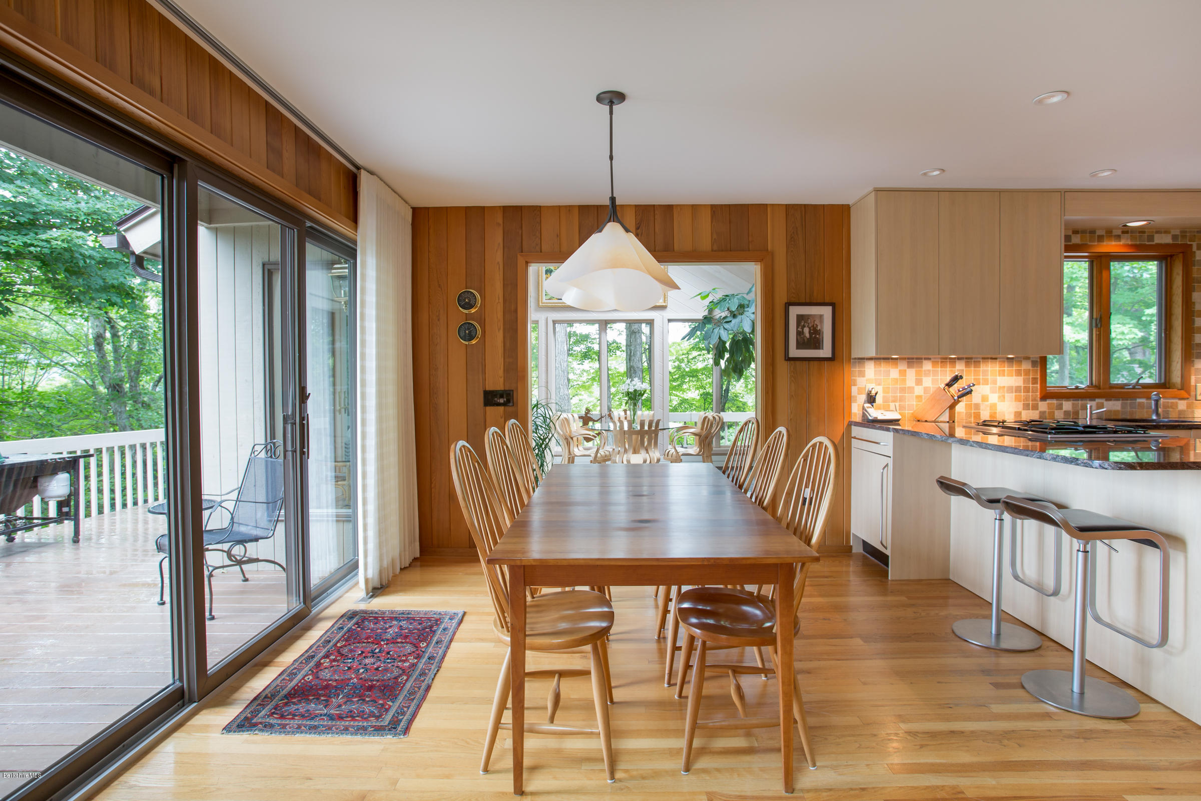 611 Main Road Monterey, MA 01245 - Photo 5 of 32 a dining room with furniture a chandelier and wooden floor