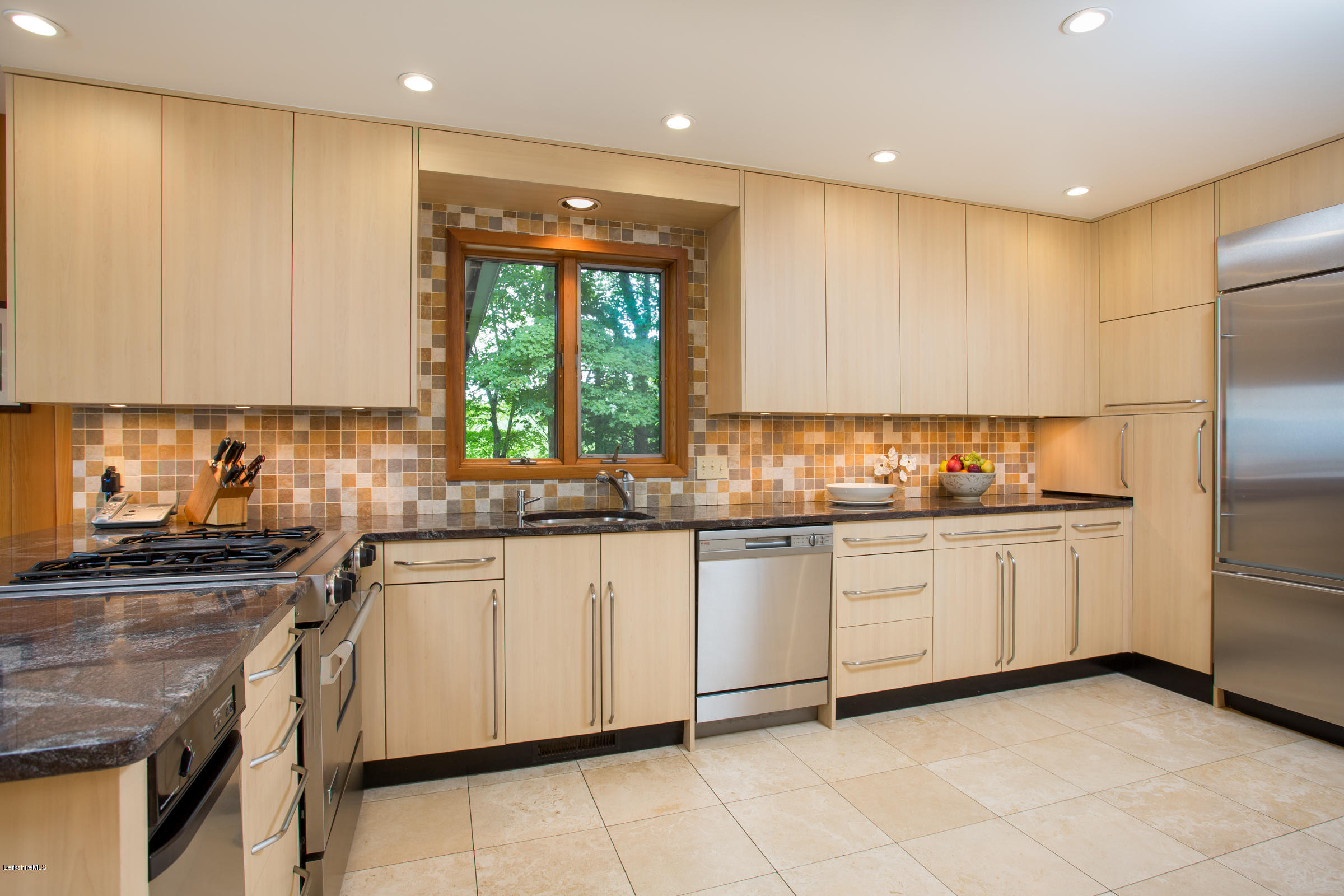 611 Main Road Monterey, MA 01245 - Photo 6 of 32 a kitchen with granite countertop cabinets stainless steel appliances a sink and a window
