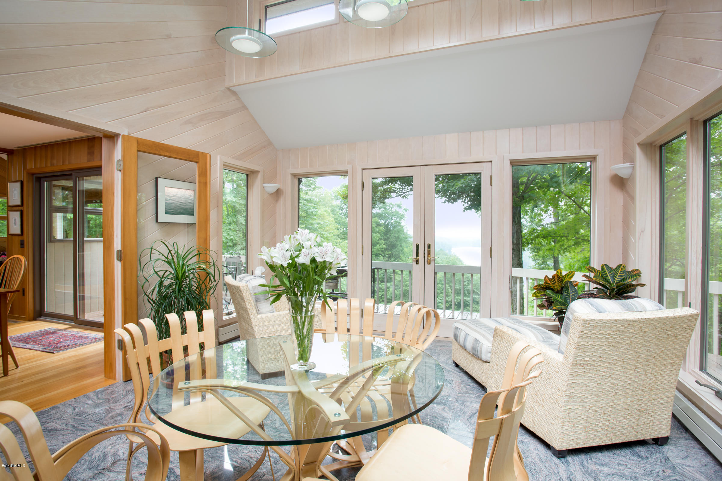 611 Main Road Monterey, MA 01245 - Photo 8 of 32 a living room with furniture large windows and wooden floor