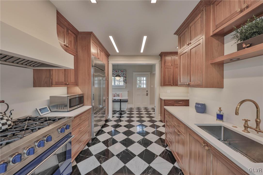 837 Tioga Avenue Bethlehem, PA 18018 - Photo 23 of 50 a kitchen with stainless steel appliances granite countertop a sink stove and cabinets