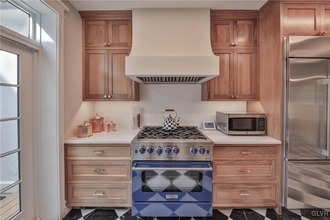 837 Tioga Avenue Bethlehem, PA 18018 - Photo 25 of 50 a kitchen with a stove and a refrigerator