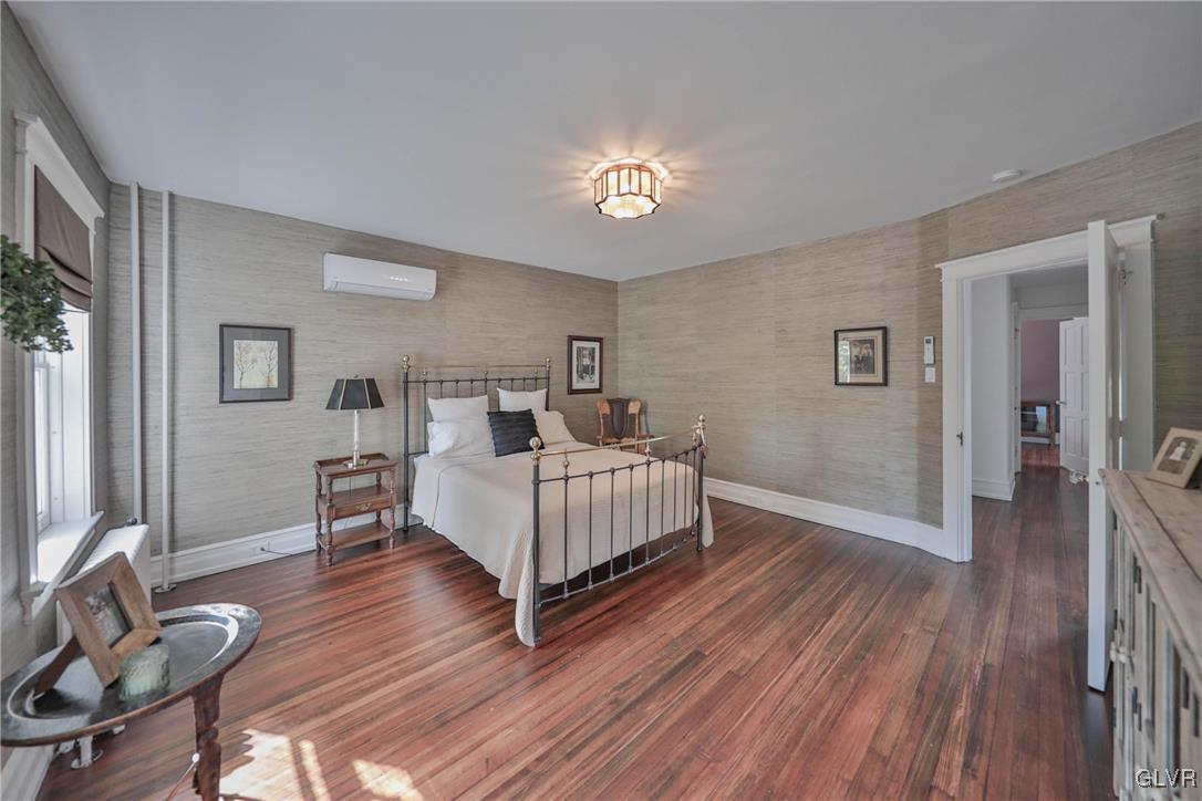 837 Tioga Avenue Bethlehem, PA 18018 - Photo 32 of 50 a bedroom with a bed and wooden floor