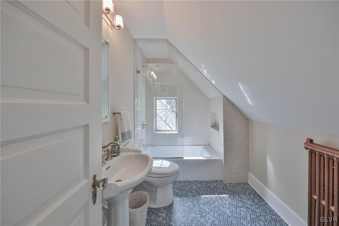 837 Tioga Avenue Bethlehem, PA 18018 - Photo 44 of 50 a bathroom with a granite countertop sink a toilet and bathtub