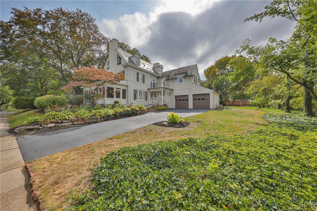 837 Tioga Avenue Bethlehem, PA 18018 - Photo 48 of 50 a front view of a house with a yard and large trees