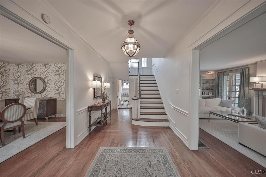 837 Tioga Avenue Bethlehem, PA 18018 - Photo 6 of 50 a view of a hallway with wooden floor and workspace