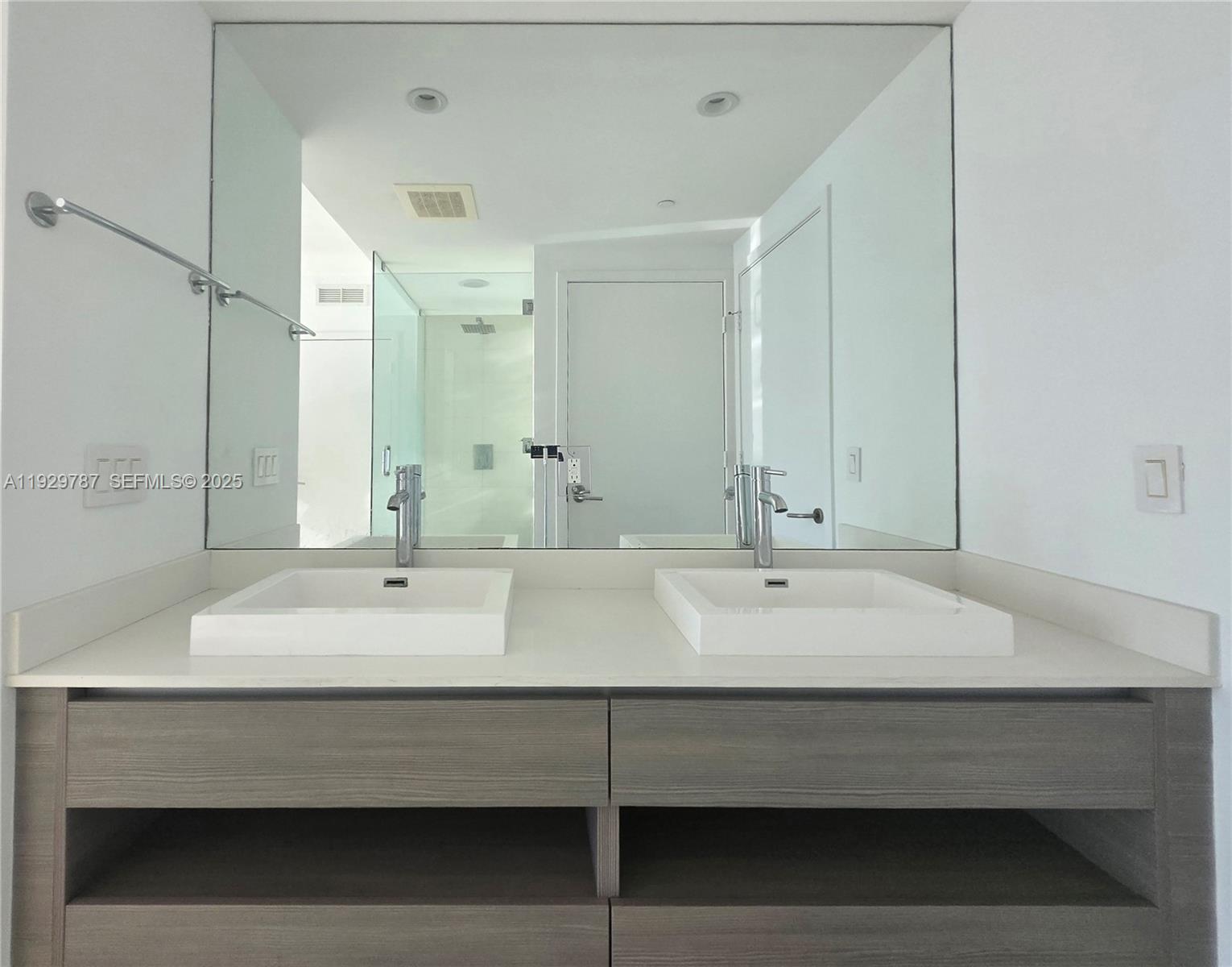 460 Northeast 28th Street, Unit 2407 Miami, FL 33137 - Photo 16 of 50 a bathroom with a sink double vanity and a mirror