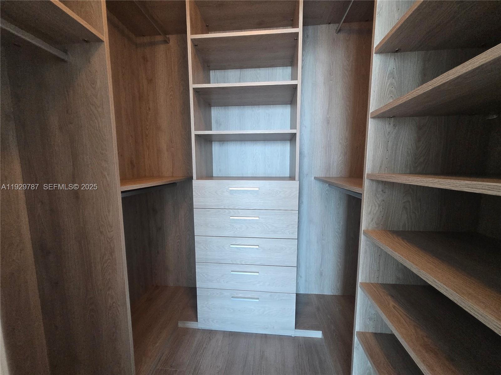 460 Northeast 28th Street, Unit 2407 Miami, FL 33137 - Photo 18 of 50 a view of walk in closet with empty racks