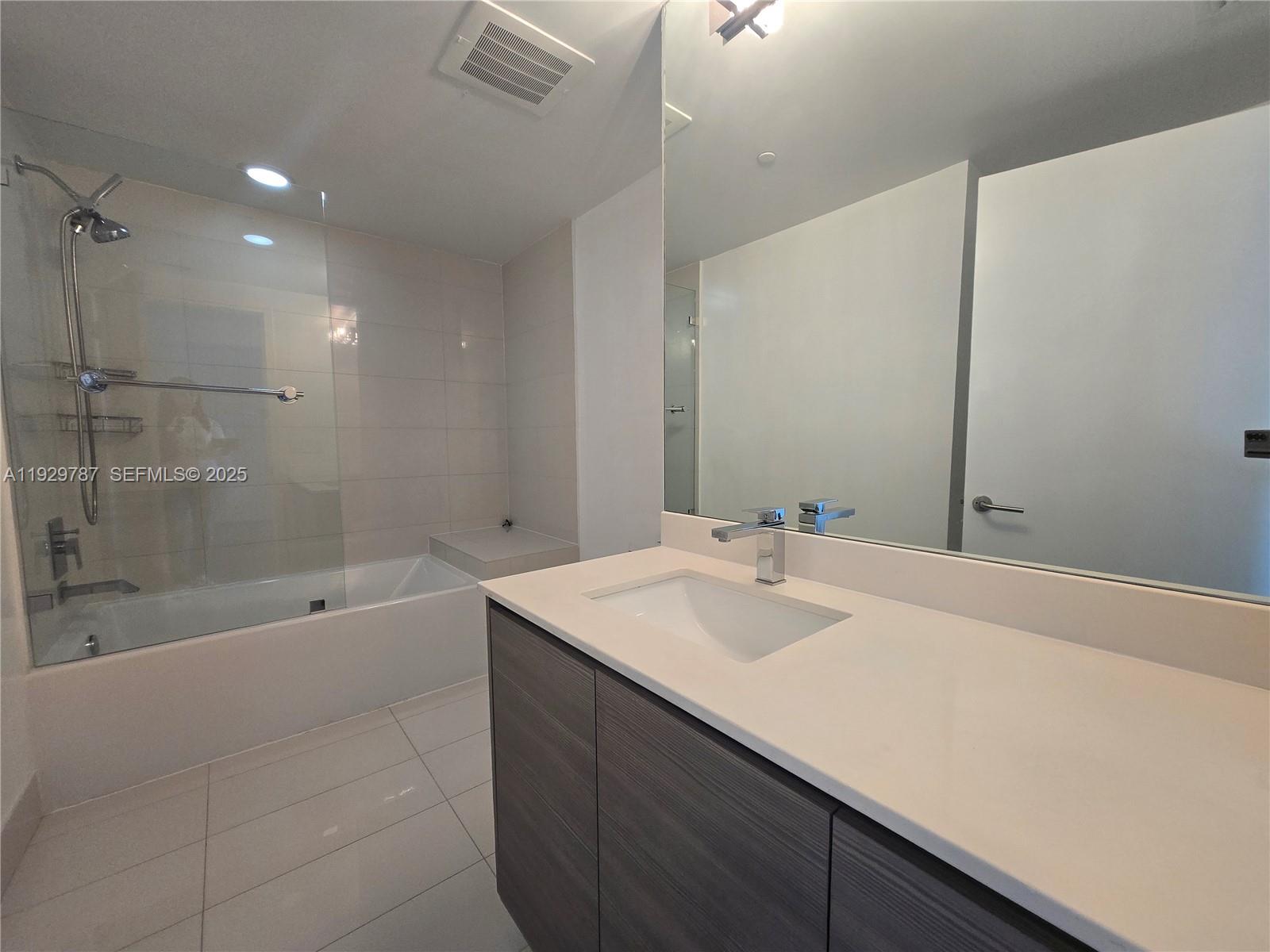 460 Northeast 28th Street, Unit 2407 Miami, FL 33137 - Photo 21 of 50 a bathroom with a bathtub and a sink