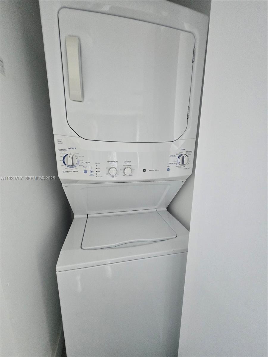 460 Northeast 28th Street, Unit 2407 Miami, FL 33137 - Photo 25 of 50 a close up view of a washer and dryer sitting on a bathroom sink