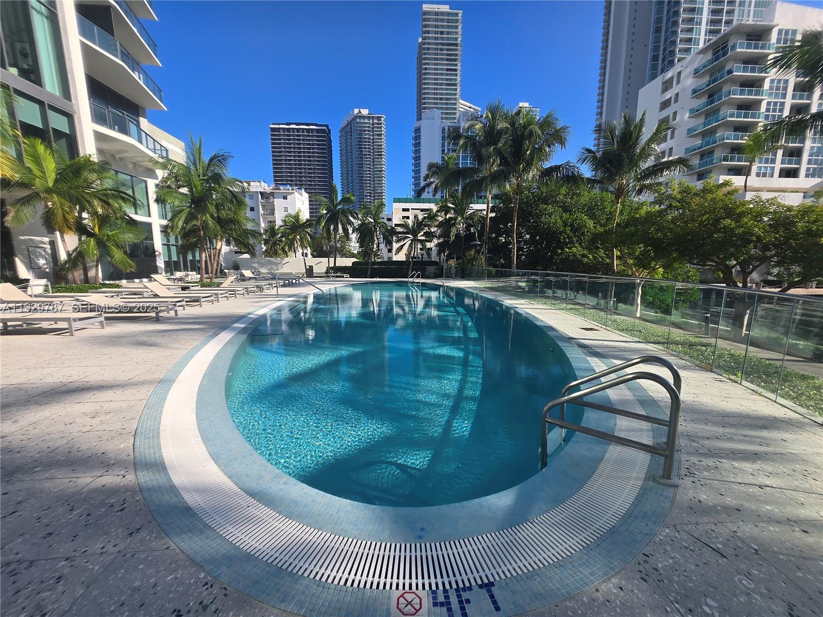 460 Northeast 28th Street, Unit 2407 Miami, FL 33137 - Photo 31 of 50 a view of a swimming pool with a patio