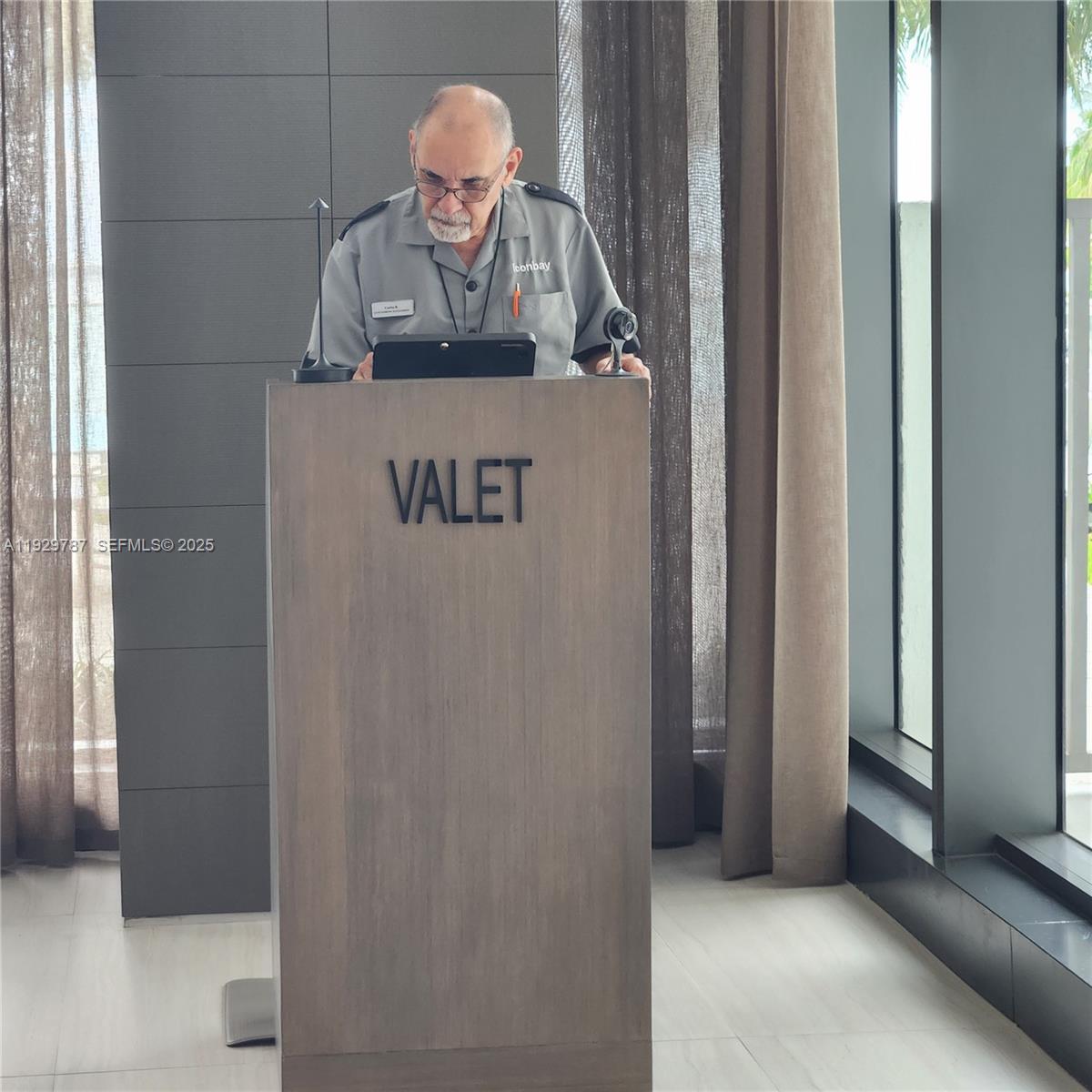 460 Northeast 28th Street, Unit 2407 Miami, FL 33137 - Photo 43 of 50 a view of a hallway with wooden floor and a utility room