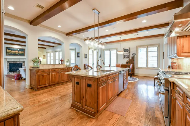 a large white kitchen with lots of counter space