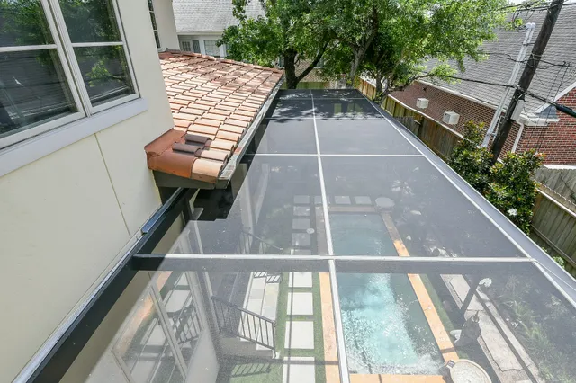 a view of balcony with wooden floor and bench