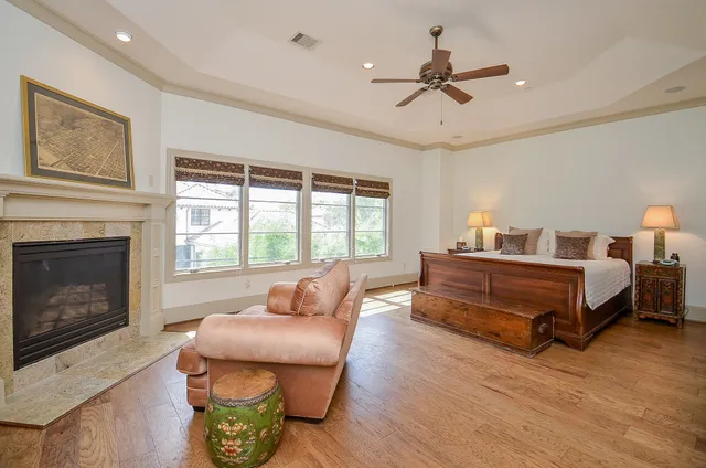 a bedroom with a bed and a fireplace