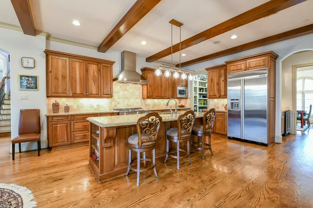 a dining table with chairs and window