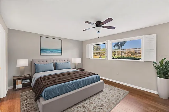 a bedroom with a large bed and a window