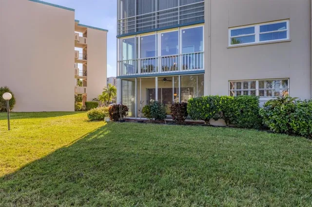 a view of a swimming pool with a yard