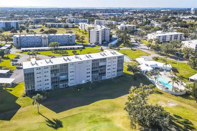 a view of a patio with a table chairs and backyard