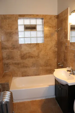 a kitchen with stainless steel appliances granite countertop a stove and a refrigerator