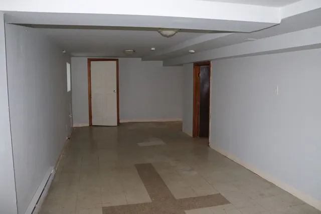 a view of a house with a yard and plants