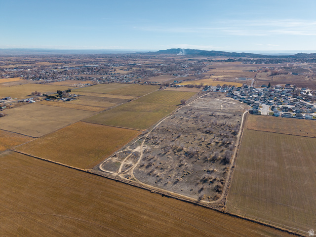 3073 West 500 South Vernal, UT 84078 - Photo 6 of 8 Aerial view of property and surrounding area featuring rural landscape and a mountainous background