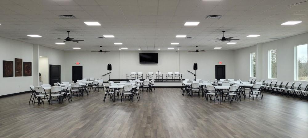 Lot 445 Ranchview Court Bowie, TX 76230 - Photo 3 of 17 a view of a dining room with furniture wooden floor and chandelier