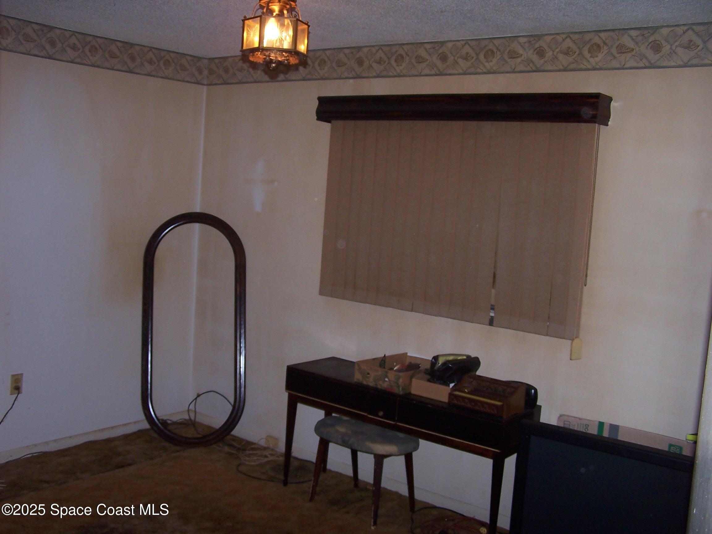 1545 Cunningham Avenue Merritt Island, FL 32952 - Photo 5 of 11 a room with a table and a potted plant