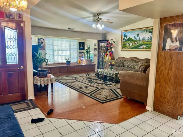 a living room with furniture and a large window