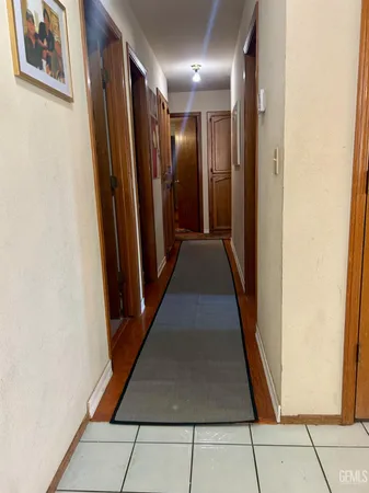 a view of gallery with wooden floor